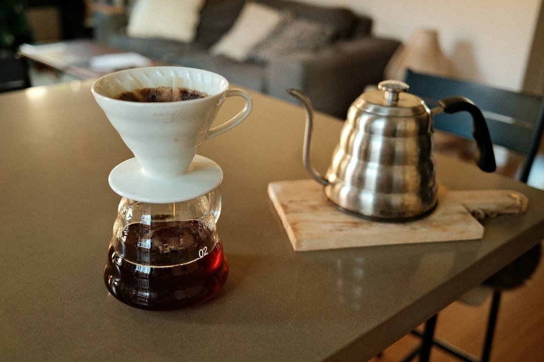 Coffee brewing setup with a carafe and kettle.