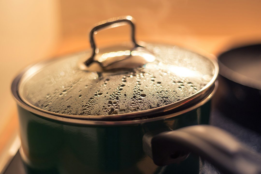 Cooking pot with lid in a kitchen.