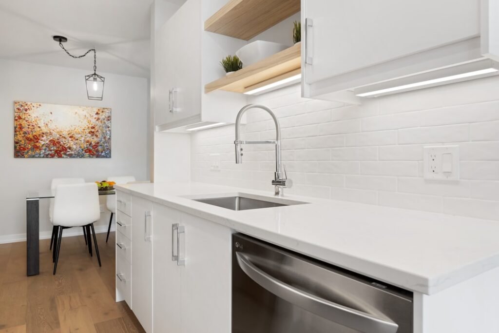 Small apartment kitchen with limited counter space beside the sink