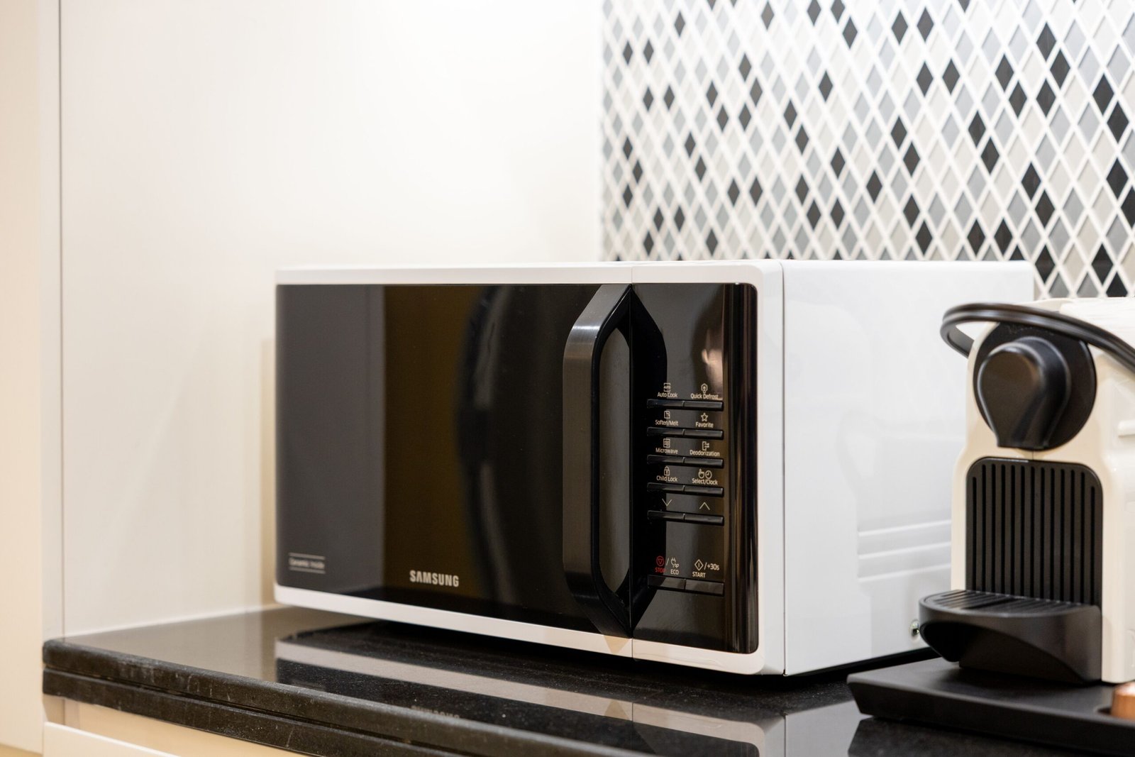 Microwave on a kitchen counter.