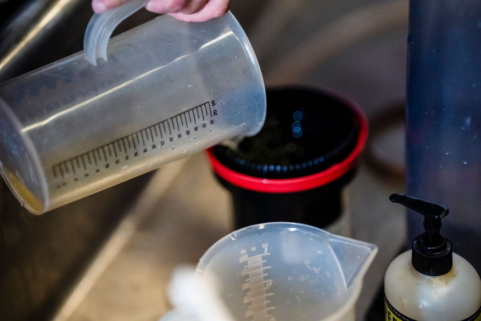Clear kitchen measuring cup used for volume measurement.